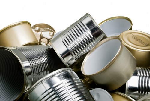 Workers using protective gloves and handling green waste